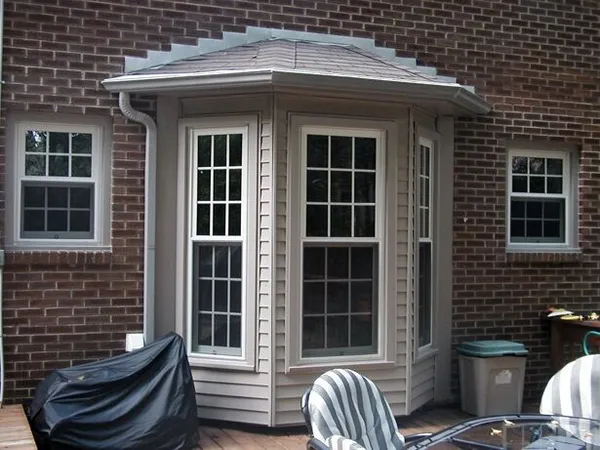 Bay/bow window combination on home exterior