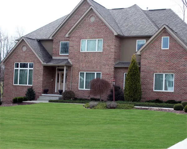 Home exterior with replacement windows and doors