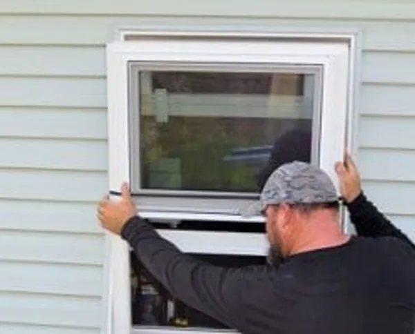Window installation process — crew at work